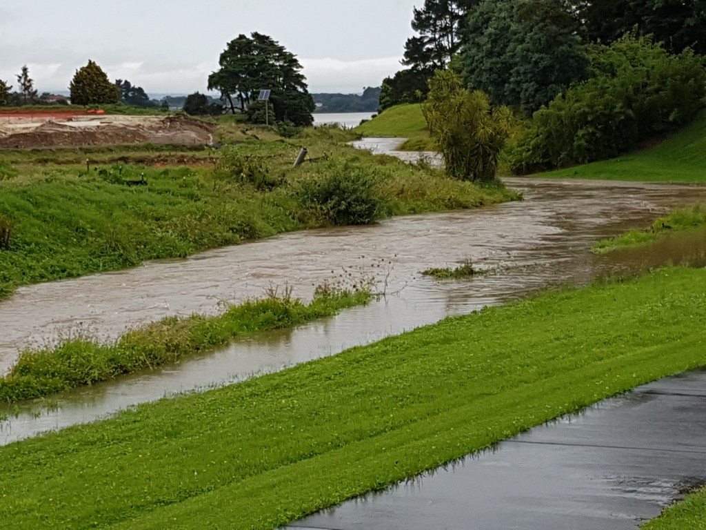 Papakura Stream in flood before discharging in the Manukaui Harbour 